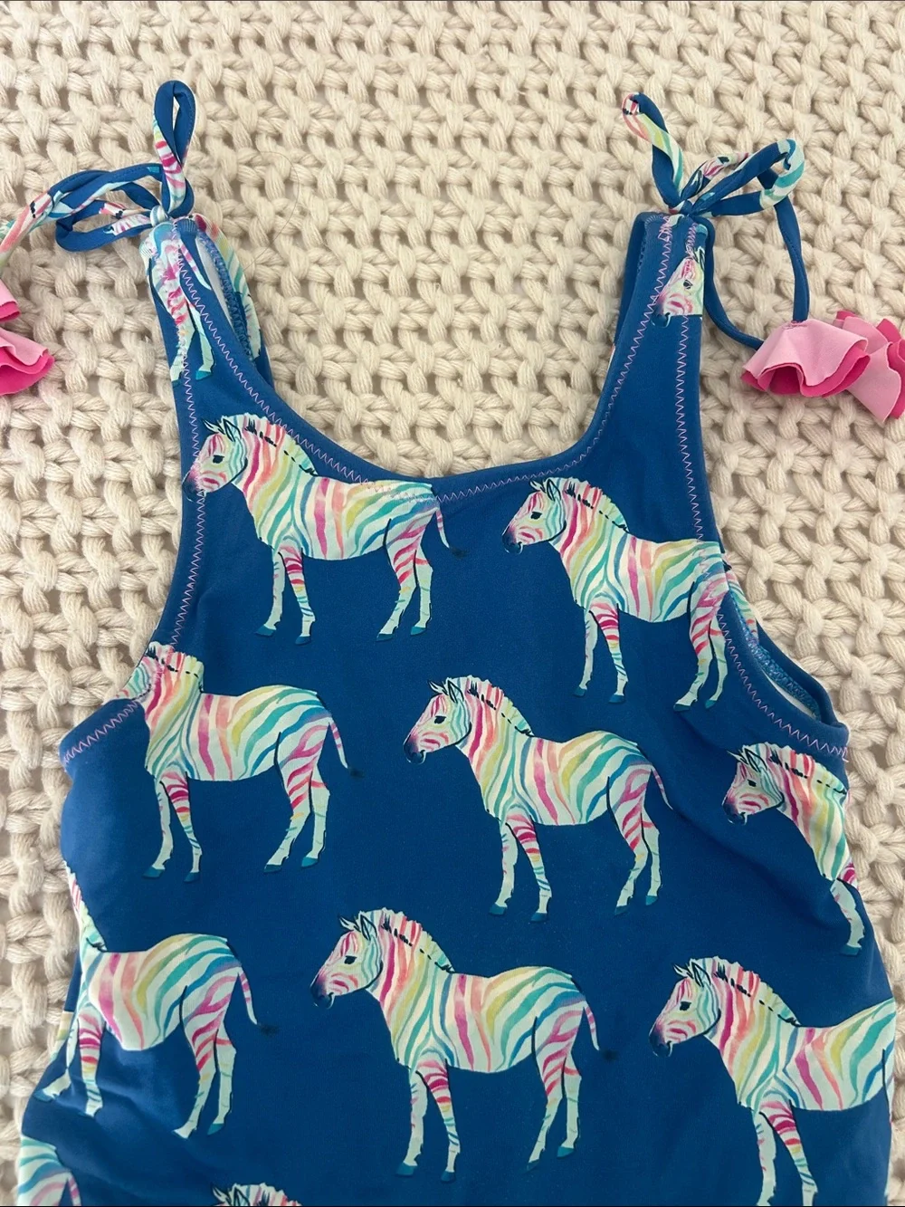 Hatley Navy One-Piece Swimsuit with Rainbow Zebra Print and Pink Tie Accents